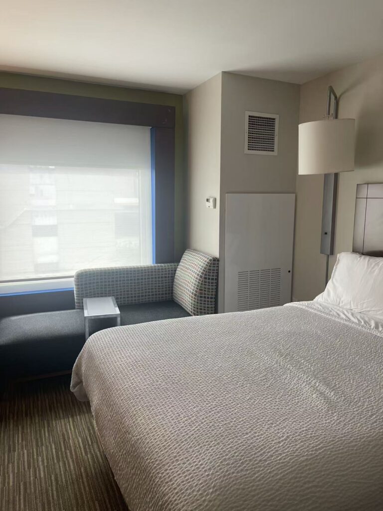 Hotel guest room with a vertical terminal enclosure
